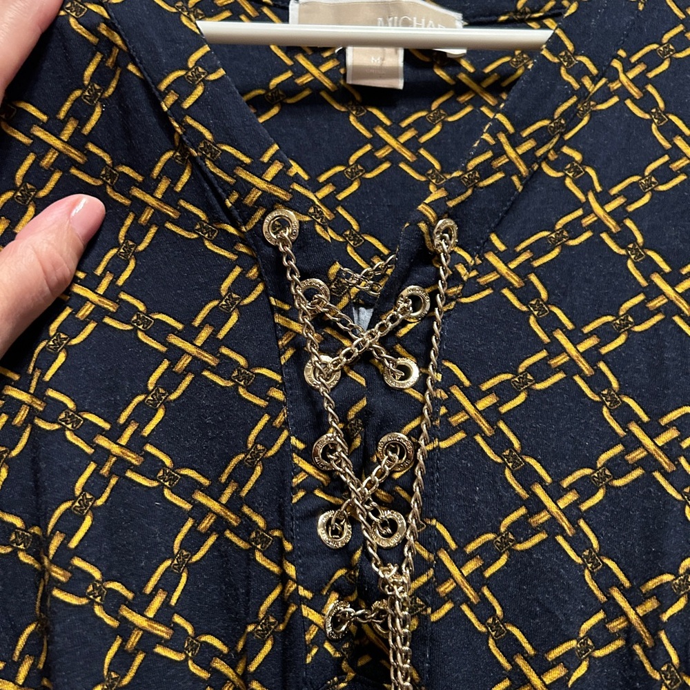 Michael Kore long sleeve chain print dress with lace up gold chain hardware
